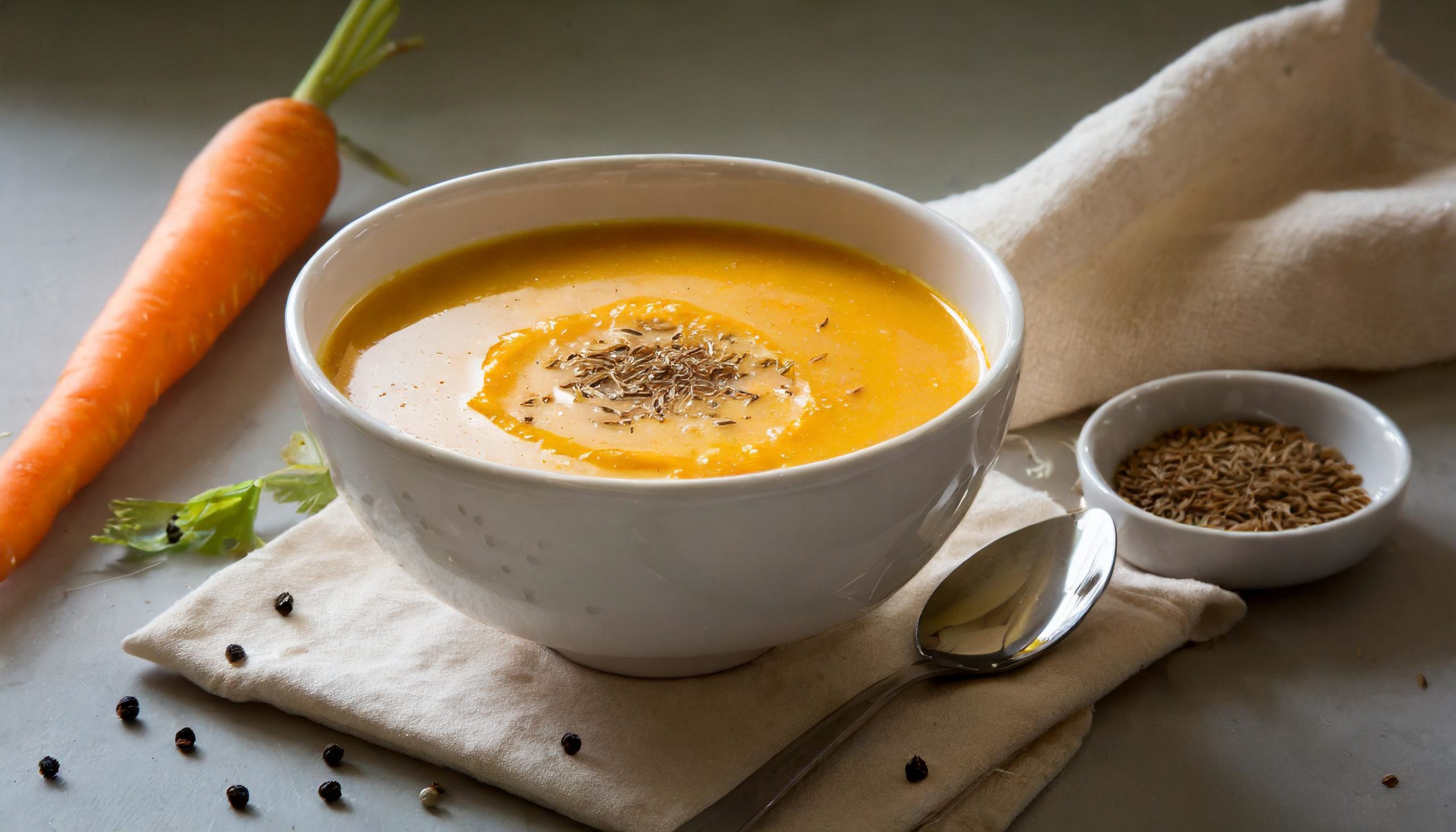 Coconut carrot soup with cumin oil