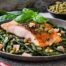 Prosciutto baked fish with garlicky beans & wilted spinach